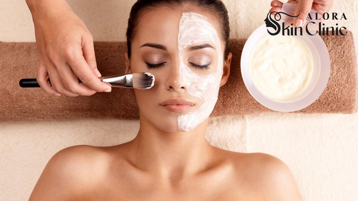 Esthetician applying a facial mask during a professional facial in Scarborough.